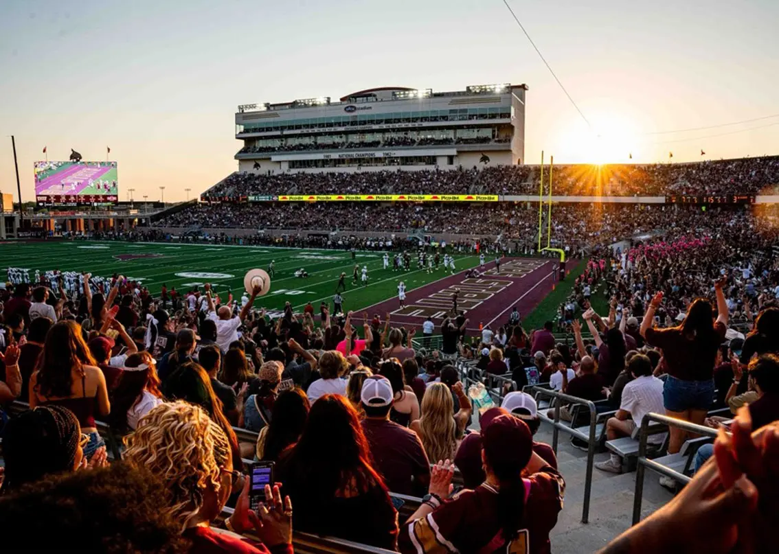 View of full stadium during a game at sundown