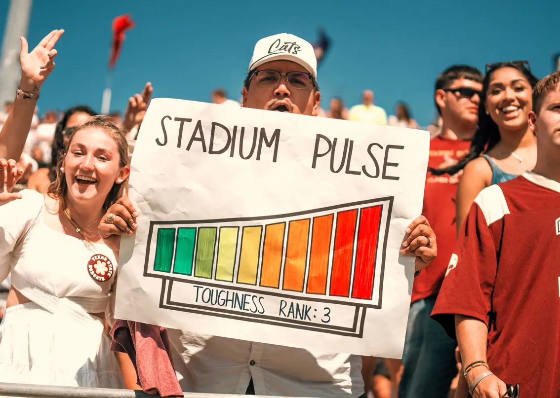 Fan holding a handmade sign